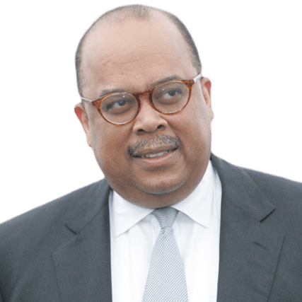 A middle-aged man wearing glasses and a suit looks thoughtfully to the side. This image may illustrate leadership or professional context.